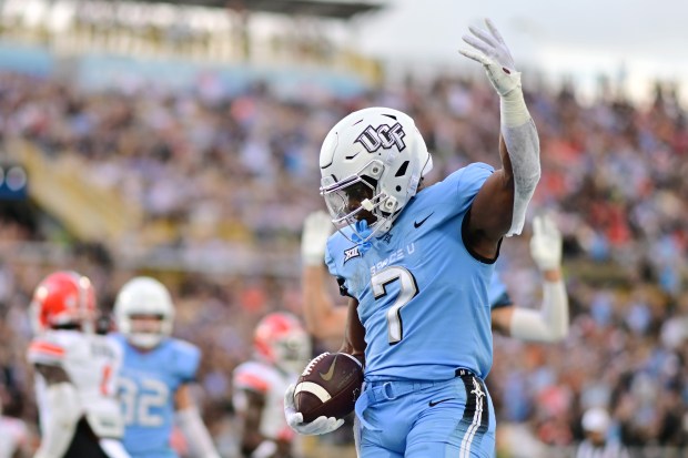 UCF's RJ Harvey ran for 207 yards and three TDs in running back duel with the nation's leading rusher - Oklahoma State's Ollie Gordon II. (Photo by Julio Aguilar/Getty Images)