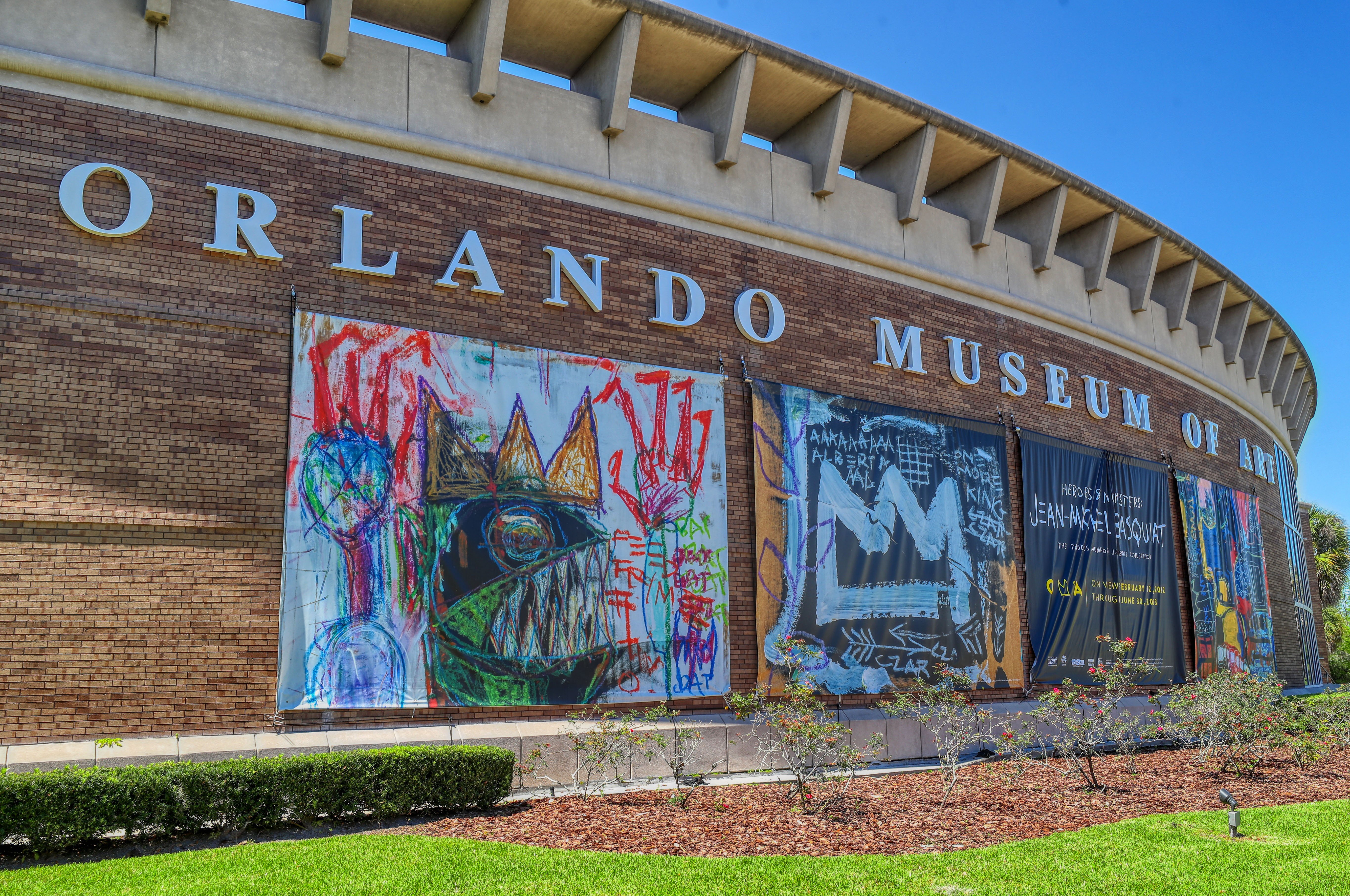 Banners advertising the "Heroes & Monsters" exhibit hang on the Orlando Museum of Art in March 2022. (Ricardo Ramirez Buxeda/ Orlando Sentinel file photo)