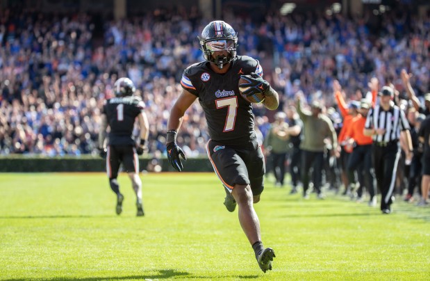 Florida running back Trevor Etienne scores a touchdown during the Gators' 39-36 heart-breaking loss to Arkansas Nov. 4 at Ben Hill Griffin Stadium in Gainesville. (Willie J. Allen Jr./Orlando Sentinel)