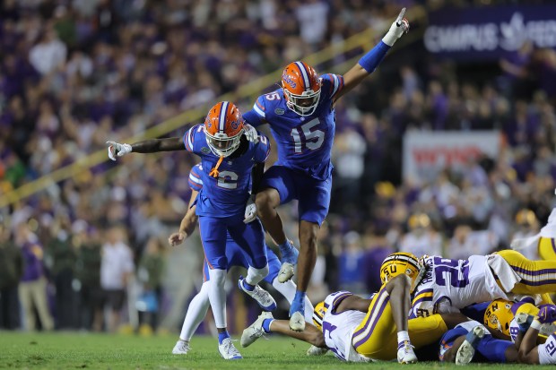 Florida veteran linebacker Derek Wingo and freshman cornerback Ja'Keem Jackson celebrate a recovered fumble on a kick return that set up a Gators' touchdown during a 52-25 loss Nov. 11 in Baton Rouge. (Photo by Jonathan Bachman/Getty Images)