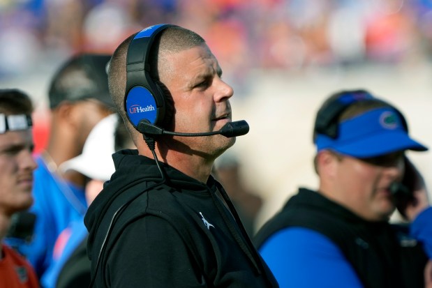 Florida head coach Billy Napier watches play during the first half of an NCAA college football game against Georgia, Saturday, Oct. 28, 2023, in Jacksonville, Fla. (AP Photo/John Raoux)