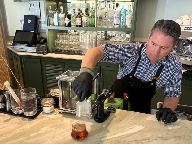 Four Seasons' lead bartender Michael Milligan leads a mixology masterclass. (Photo by David Dickstein)