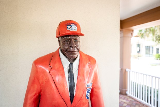 A life-sized statue of Winter Park native and Tuskegee Airman Chief Master Sgt. Richard Hall Jr. is outside of Hannibal Square Heritage Center in Winter Park on Sept. 21, 2023. (Patrick Connolly/Orlando Sentinel)