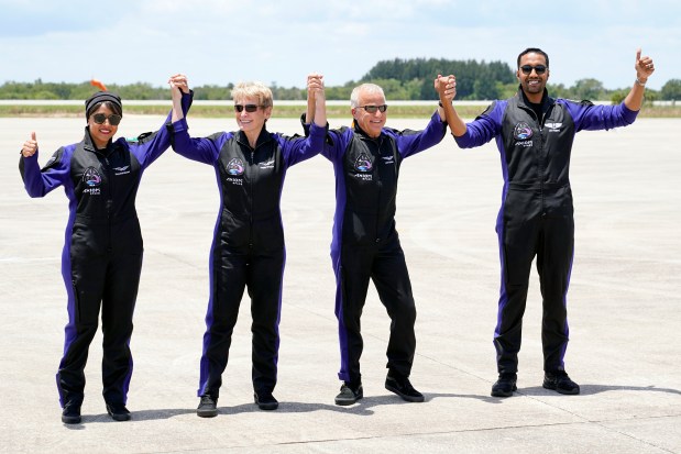 The crew of the SpaceX Falcon 9 rocket, with the Crew Dragon spacecraft, from left, Saudi Arabian astronaut Rayyanah Barnawi, commandeer Peggy Whitson, pilot John Shoffner and Saudi Arabian astronaut Ali al-Qarni arrive at the Kennedy Space Center before their launch to the International Space Station, Sunday, May 21, 2023. (AP Photo/John Raoux)